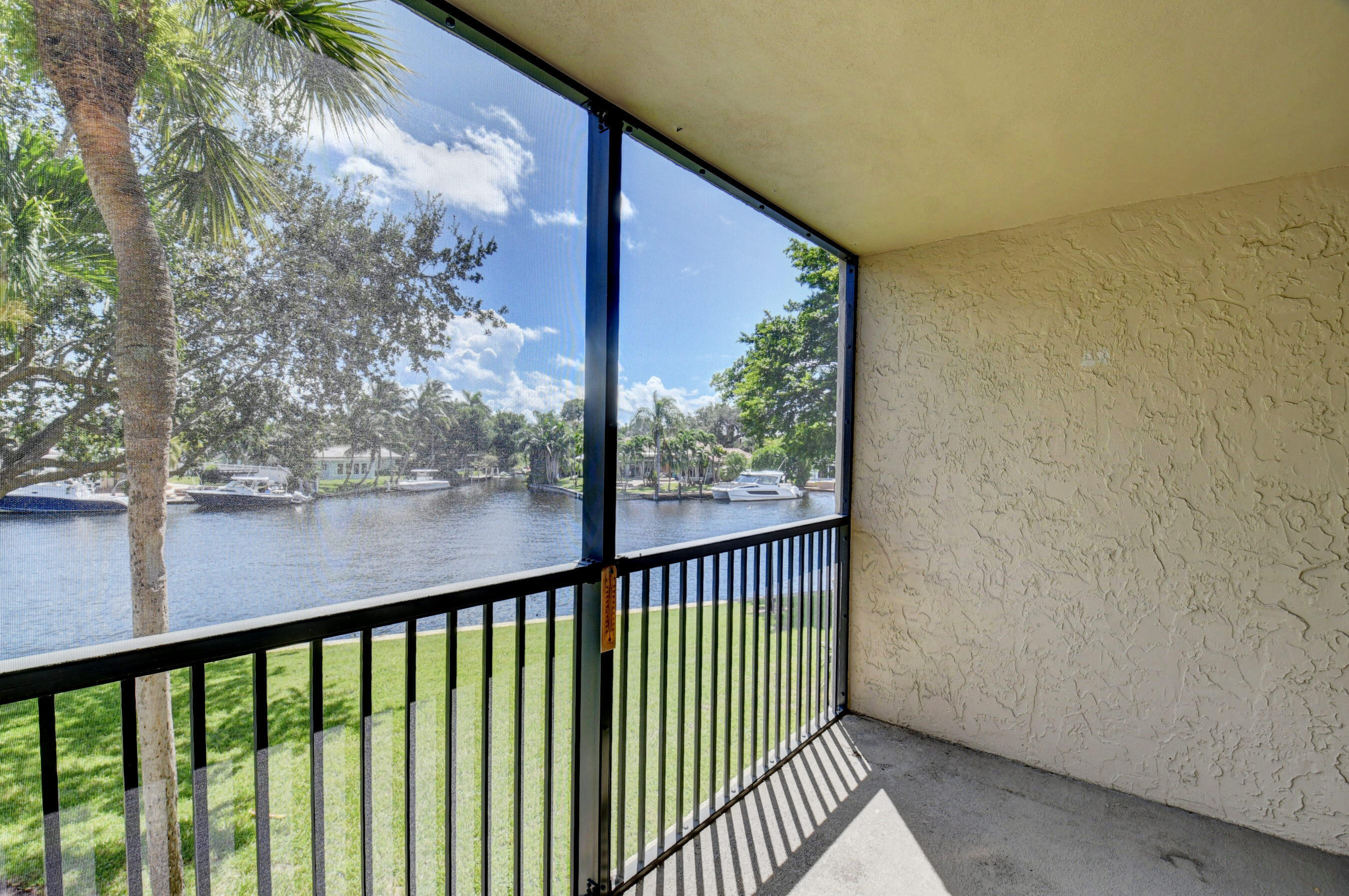 14 Royal Palm Way, Unit 2050 Boca Raton, FL 33432 - Photo 13 of 44 a view of a balcony with a tree