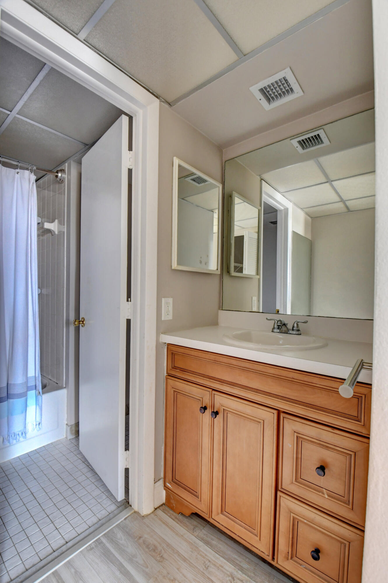 14 Royal Palm Way, Unit 2050 Boca Raton, FL 33432 - Photo 28 of 44 a spacious bathroom with a granite countertop sink mirror and cabinets