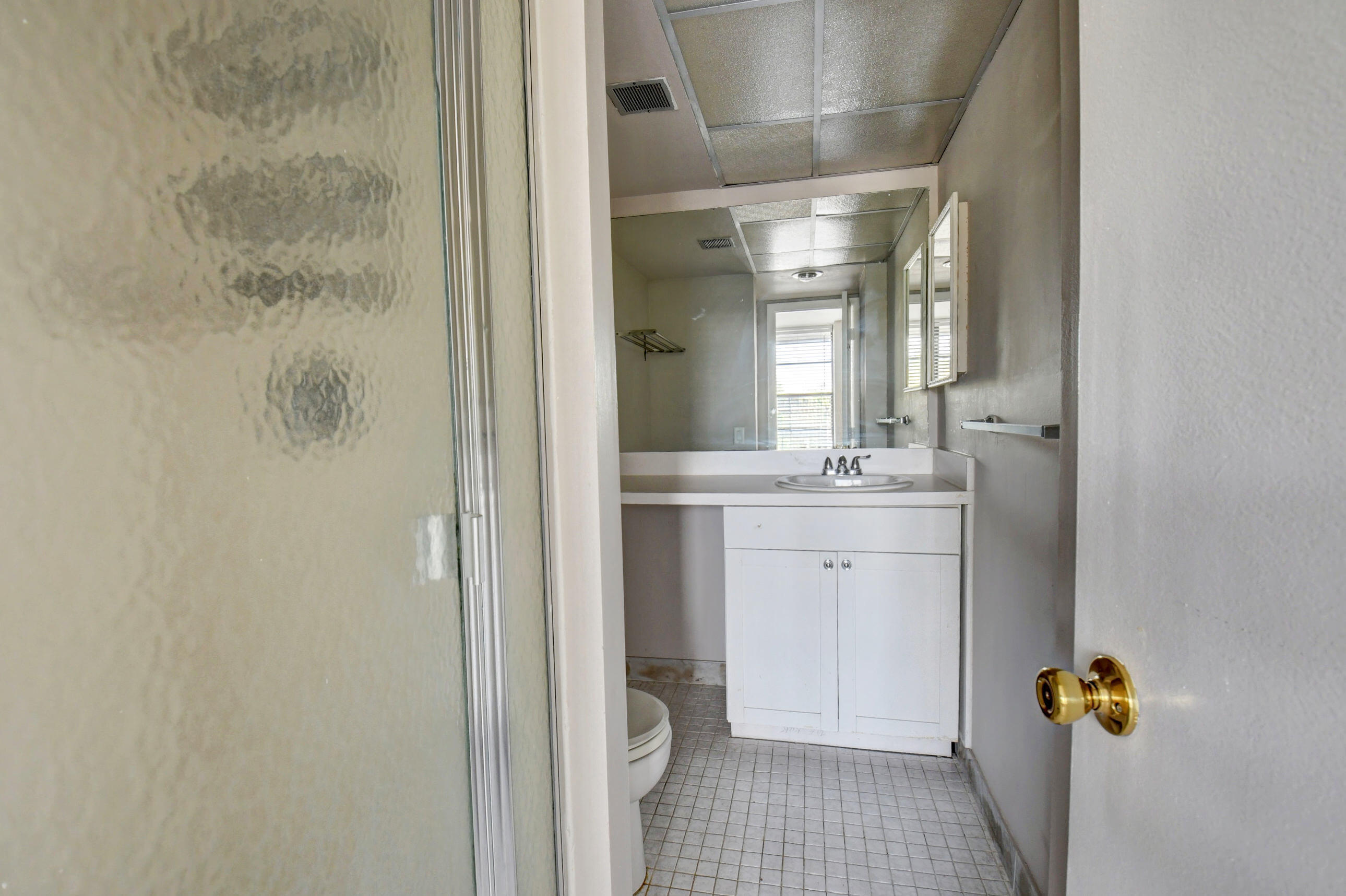 14 Royal Palm Way, Unit 2050 Boca Raton, FL 33432 - Photo 32 of 44 a bathroom with a sink a toilet and shower