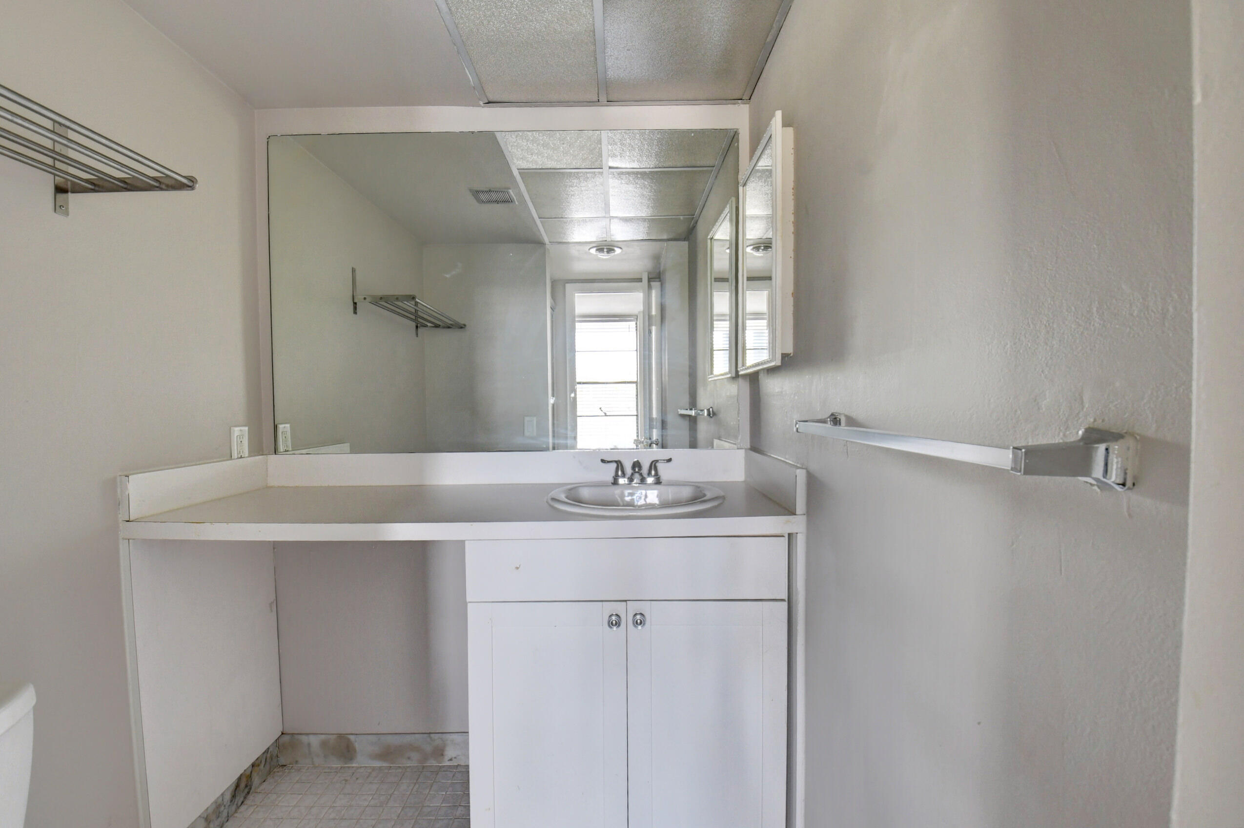 14 Royal Palm Way, Unit 2050 Boca Raton, FL 33432 - Photo 33 of 44 a bathroom with a granite countertop sink a toilet and a mirror
