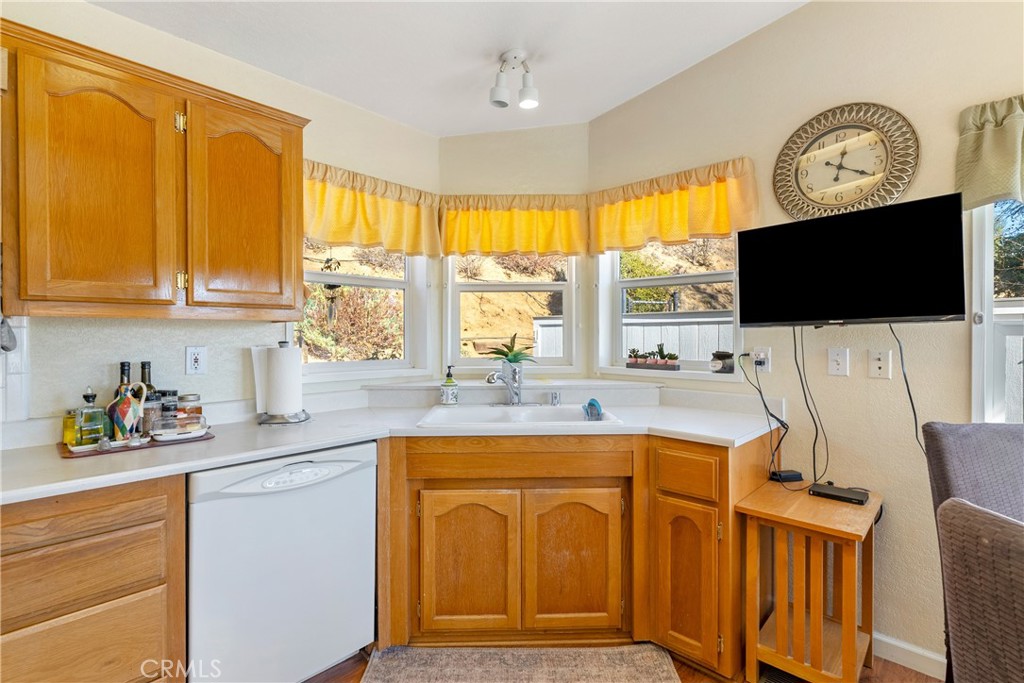 4135 Peruvian Way Paso Robles, CA 93446 - Photo 12 of 45 Corner sink with windows to the world outside. Lots of quail and dove to watch daily.