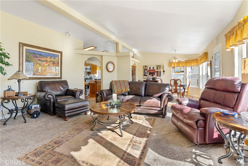 4135 Peruvian Way Paso Robles, CA 93446 - Photo 18 of 45 The living room offer plenty of space for family and friends with lots of windows for sunshine and views.