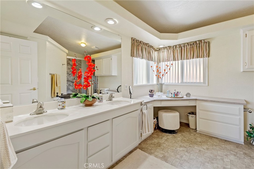 4135 Peruvian Way Paso Robles, CA 93446 - Photo 27 of 45 Primary bathroom with dual sinks and large vanity and lots of storage.