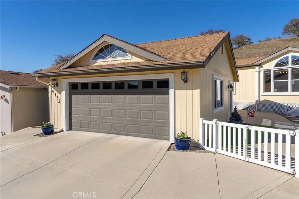 4135 Peruvian Way Paso Robles, CA 93446 - Photo 4 of 45 Detached garage has attic storage, auto door opener and in extra deep on the left side for boat storage or shop with storage.