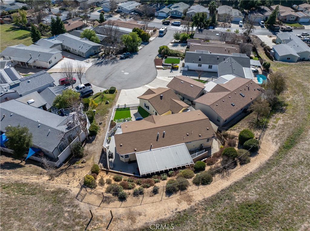 4135 Peruvian Way Paso Robles, CA 93446 - Photo 44 of 45 There is an easement for access to the greenbelt behind the property that is shown here on the left of the house. There are stairs that take you up the hill to the greenbelt and hiking trail.