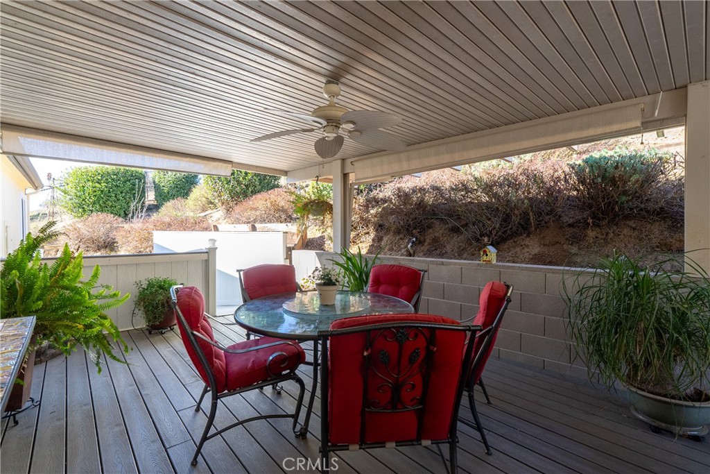 4135 Peruvian Way Paso Robles, CA 93446 - Photo 10 of 45 Aluma wood deck cover with rain gutter and drop down shades.