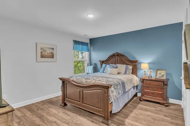a bedroom with a bed and a dresser