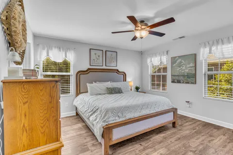 a bedroom with a large bed and a window