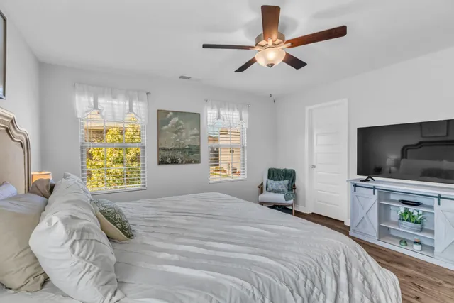 a bathroom with a double vanity sink mirror and shower