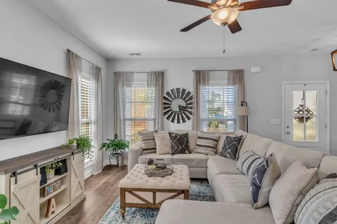 a living room with furniture and a large window