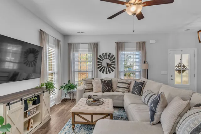 a living room with furniture and a large window