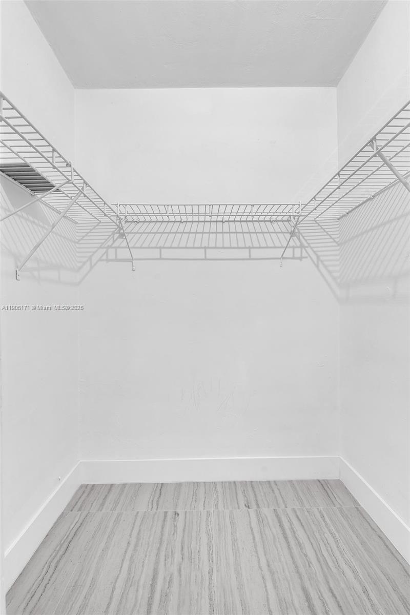 101 Southeast 6th Avenue, Unit 1 Pompano Beach, FL 33060 - Photo 15 of 30 a view of a room with racks on the wall