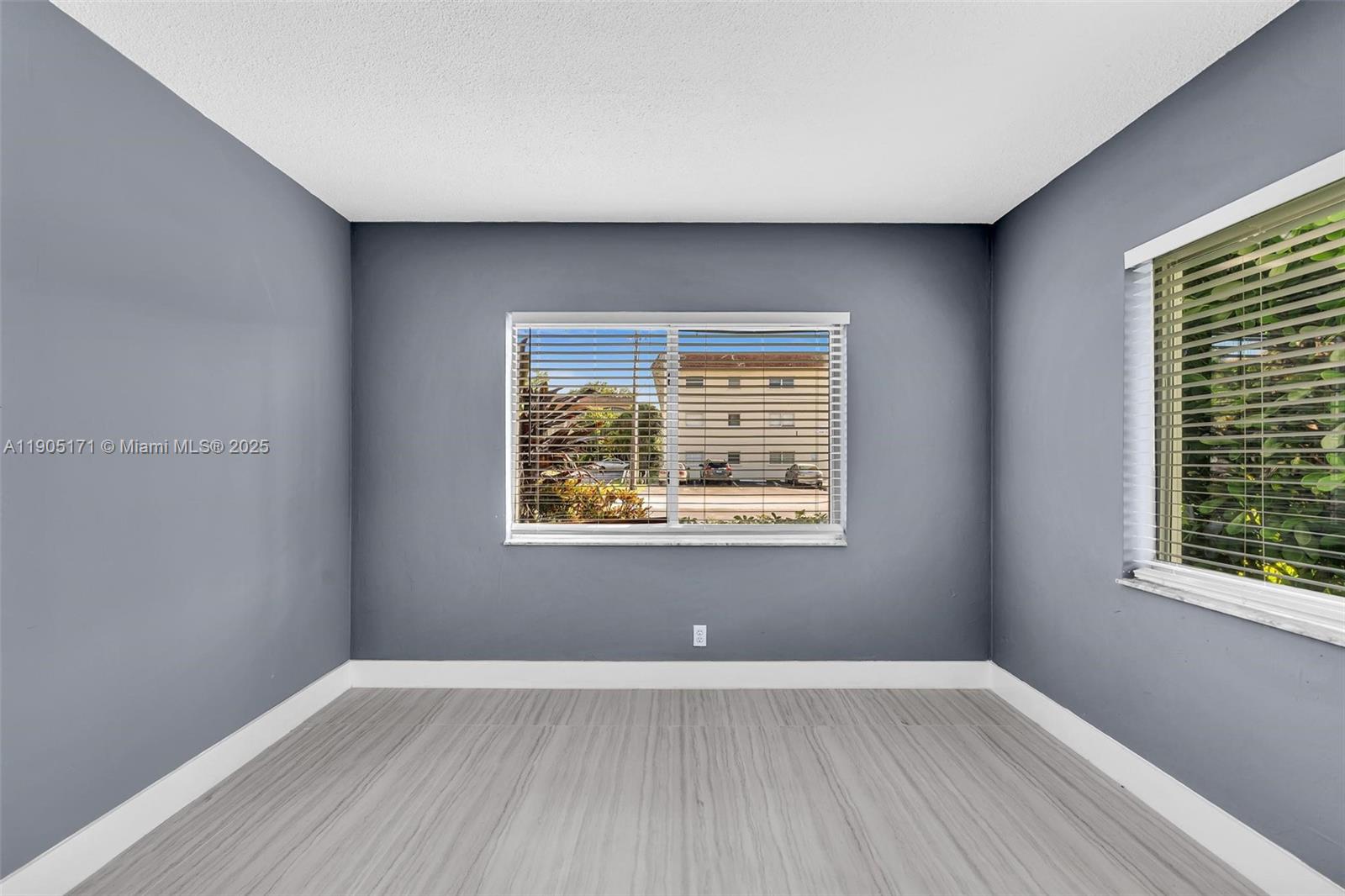 101 Southeast 6th Avenue, Unit 1 Pompano Beach, FL 33060 - Photo 20 of 30 an empty room with a window