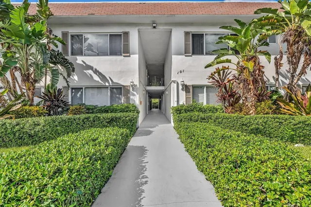 a view of potted plants in front of house