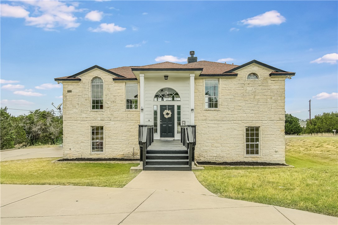4206 Glendale Road Lago Vista, TX 78645 - Photo 1 of 1 a front view of a house with a yard
