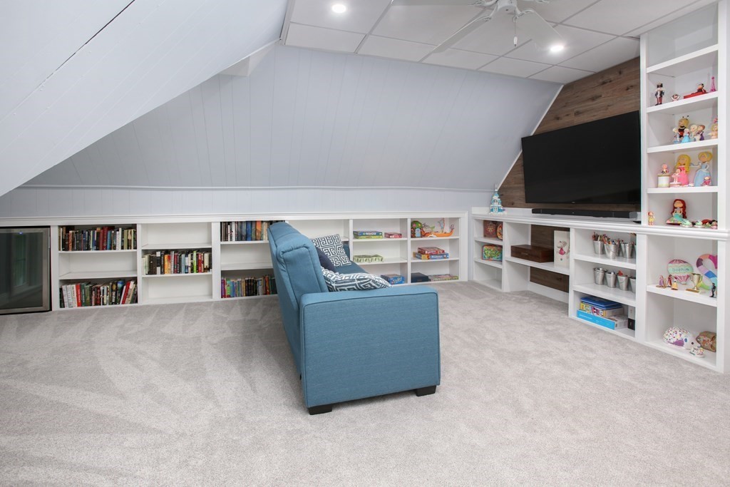 5 Braeburn Road Newton, MA 02466 - Photo 15 of 19 a living room with furniture and a flat screen tv