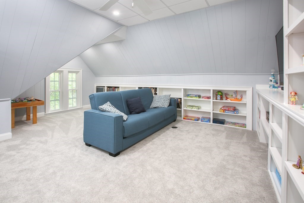 5 Braeburn Road Newton, MA 02466 - Photo 16 of 19 a living room with furniture and a flat screen tv