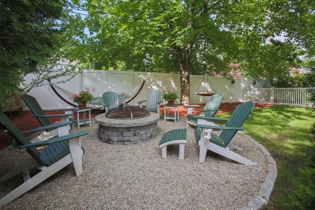 5 Braeburn Road Newton, MA 02466 - Photo 19 of 19 an outdoor sitting area with couch and wooden fence
