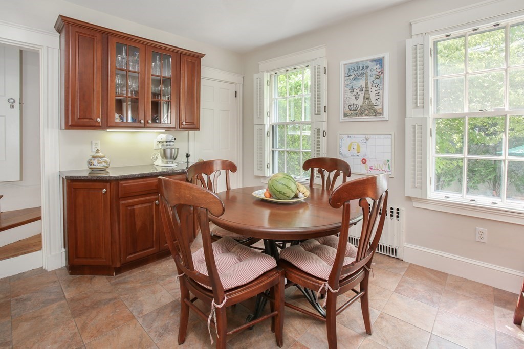 5 Braeburn Road Newton, MA 02466 - Photo 8 of 19 a view of a dining room that has a table and chairs