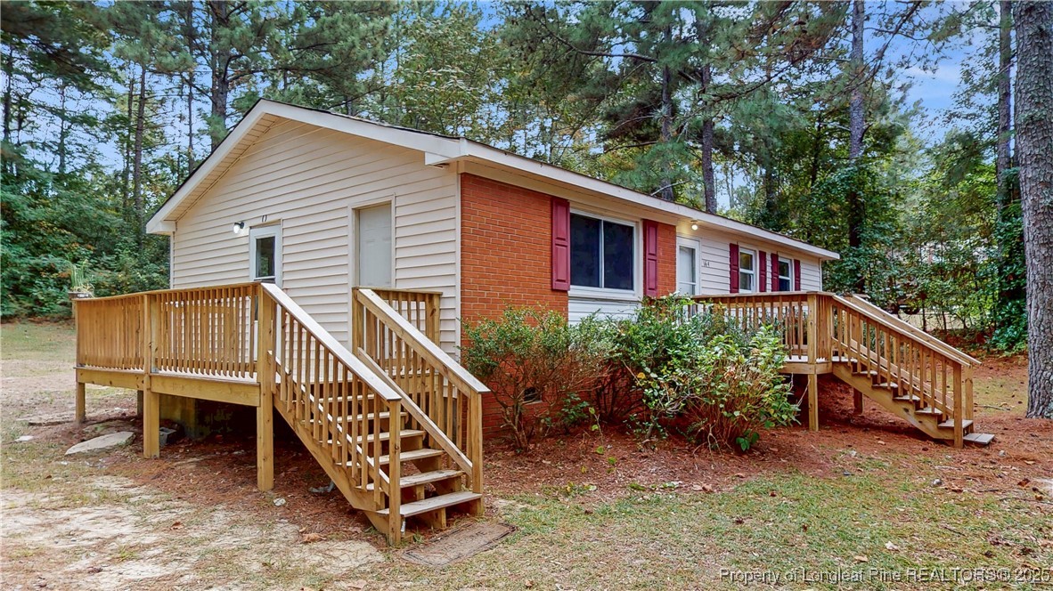 164 Happy Valley Road West End, NC 27376 - Photo 3 of 17 a view of a house with a yard and sitting area