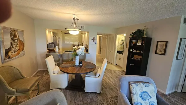 a dining room with furniture and window
