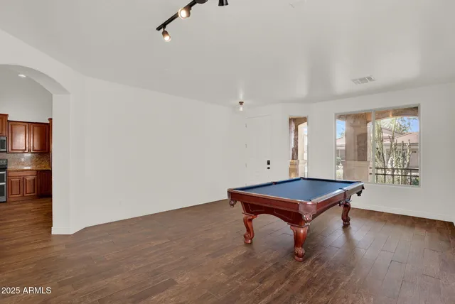 a room with furniture and wooden floor