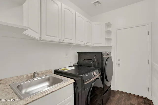 a utility room with dryer and washer