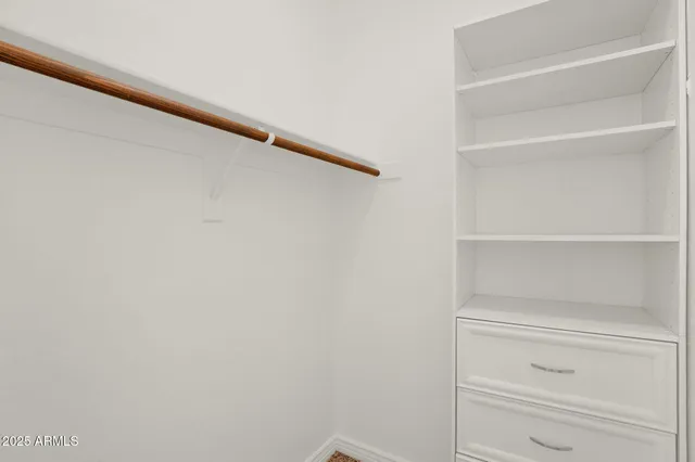a view of an empty walk in closet