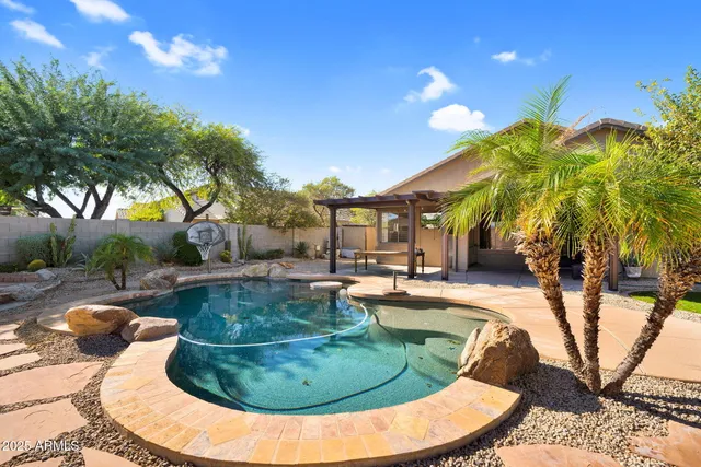 a view of a swimming pool with a patio