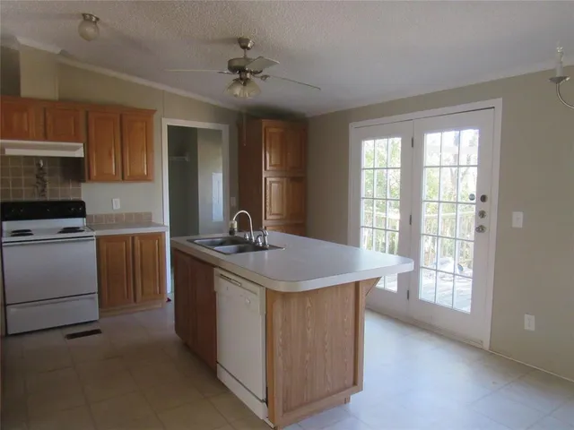 a view of an empty room with wooden floor and closet
