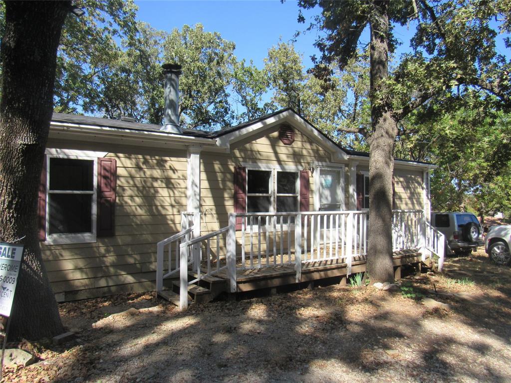 40 Cleveland Avenue Pottsboro, TX 75076 - Photo 2 of 29 a front view of a house with a yard