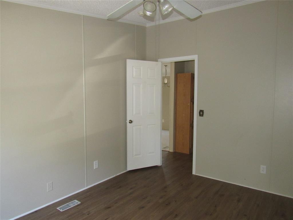 40 Cleveland Avenue Pottsboro, TX 75076 - Photo 23 of 29 a view of an empty room with wooden floor