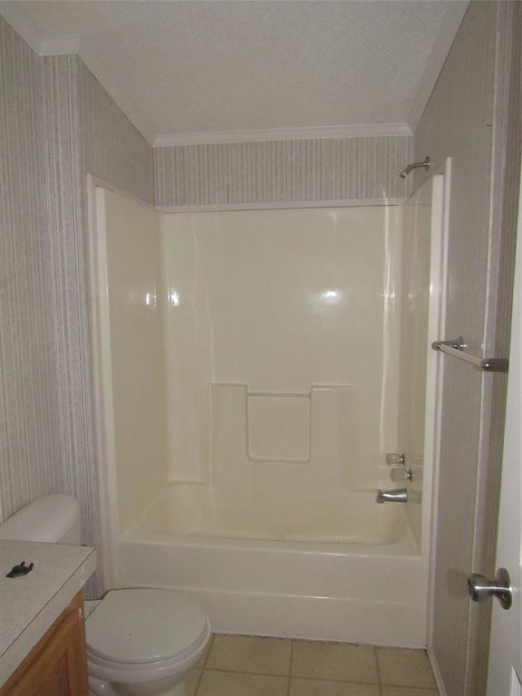 40 Cleveland Avenue Pottsboro, TX 75076 - Photo 27 of 29 a bathroom with a shower a toilet and sink