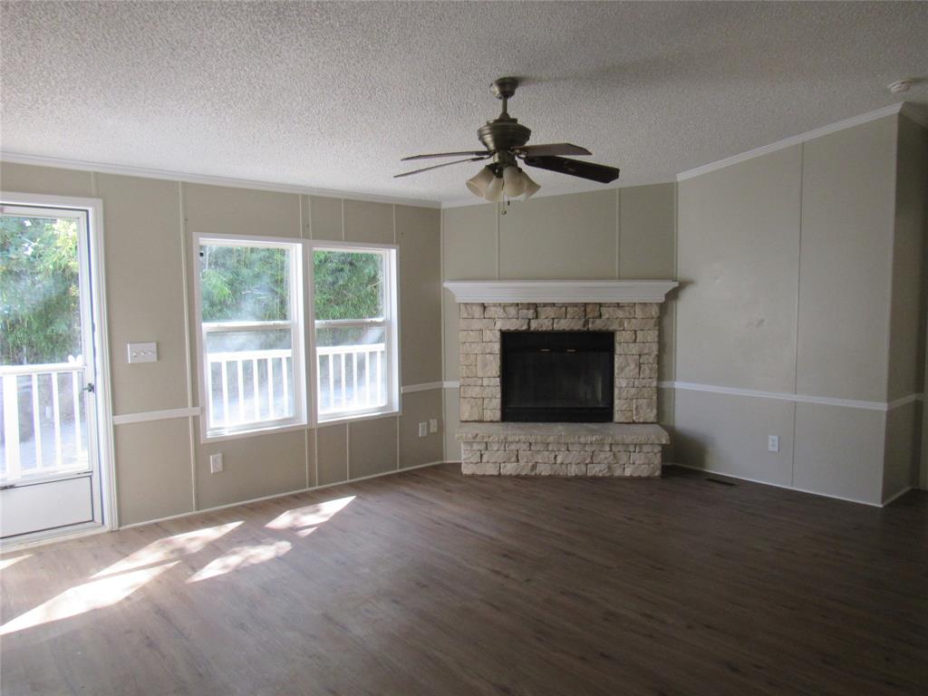 40 Cleveland Avenue Pottsboro, TX 75076 - Photo 29 of 29 a view of an empty room with a fireplace and a window