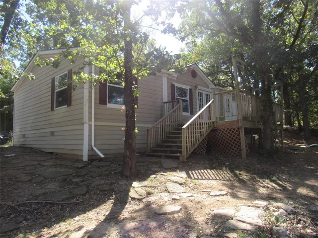 a view of a house with a small yard