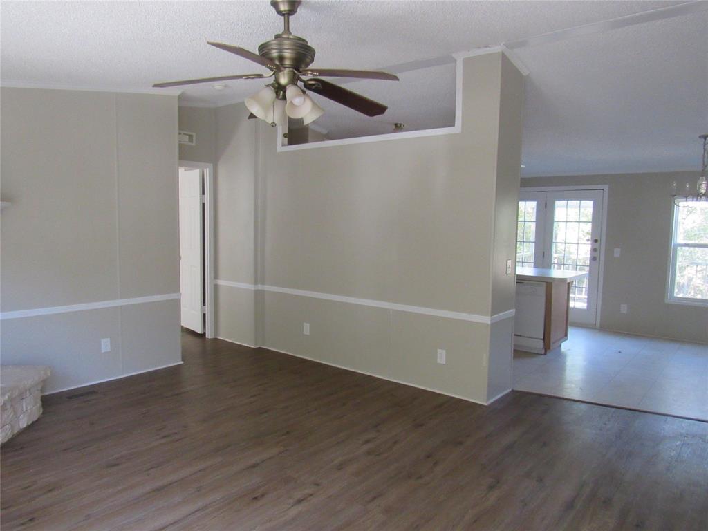 40 Cleveland Avenue Pottsboro, TX 75076 - Photo 9 of 29 an empty room with wooden floor and windows