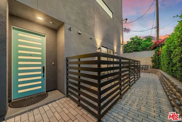 a view of outdoor space with balcony and stairs