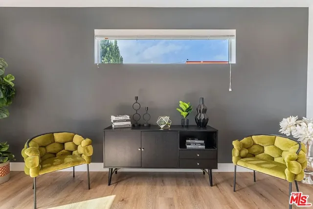 a workspace with furniture and wooden floor