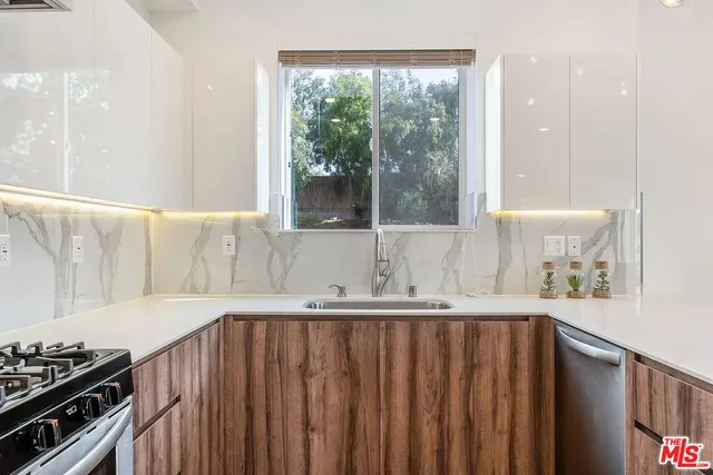 a kitchen with a sink and a window
