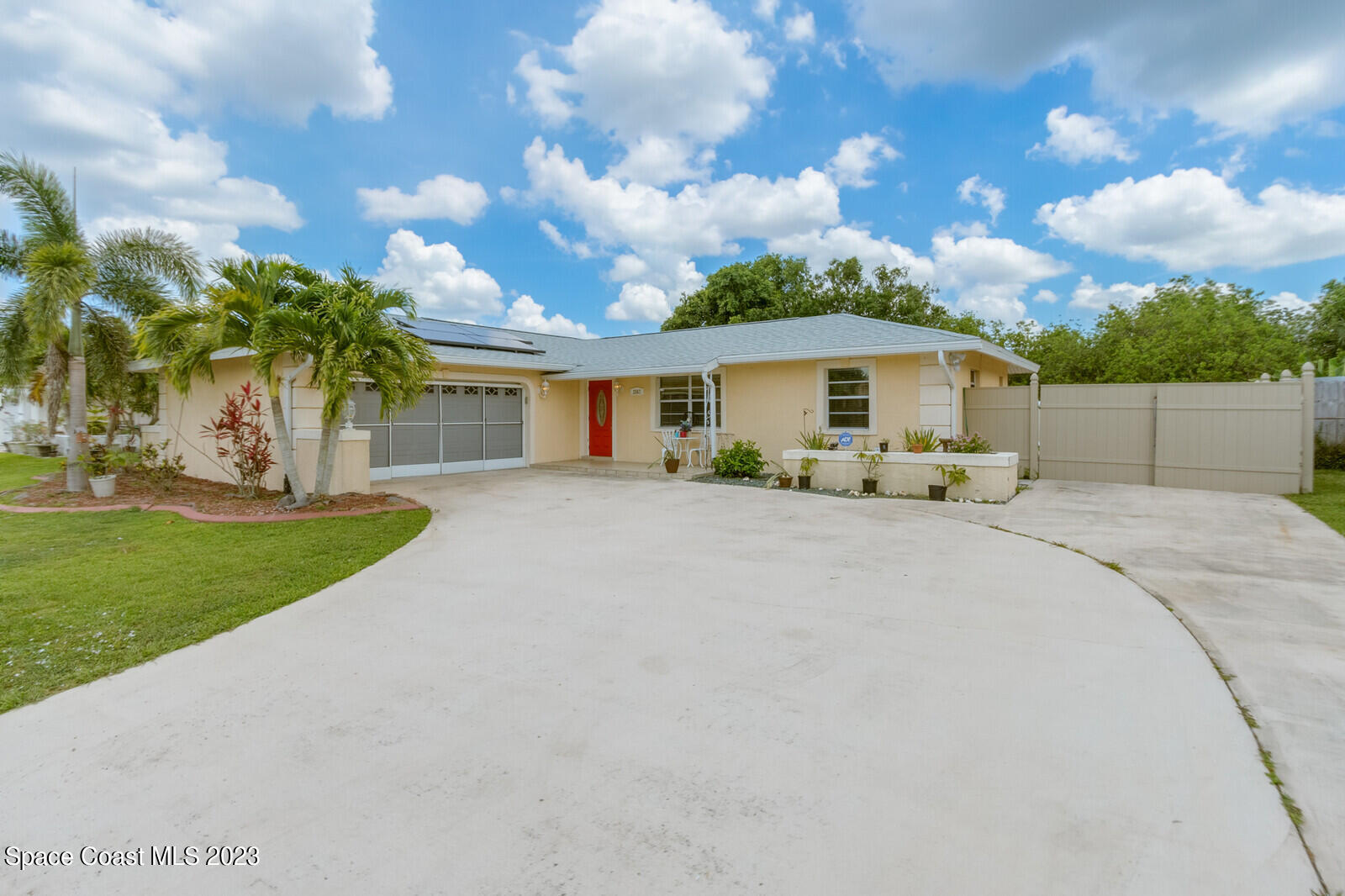 a front view of house with yard and green space