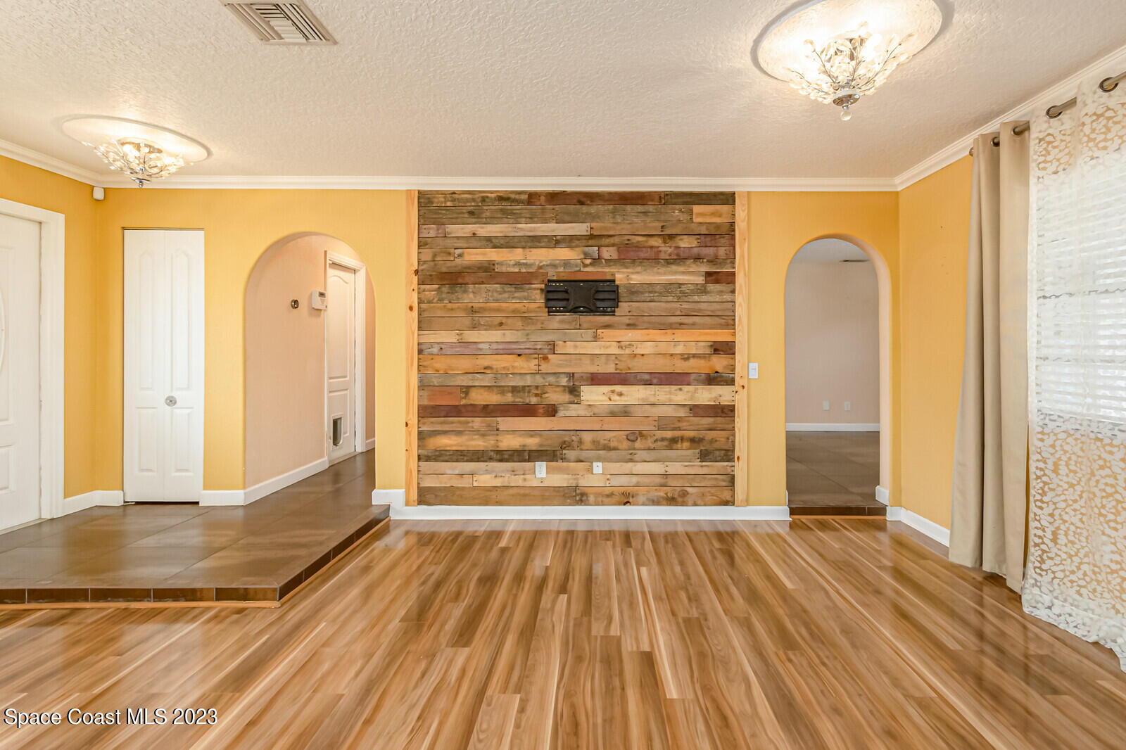 2567 Wright Avenue Melbourne, FL 32935 - Photo 20 of 36 a view of empty room with wooden floor and fan