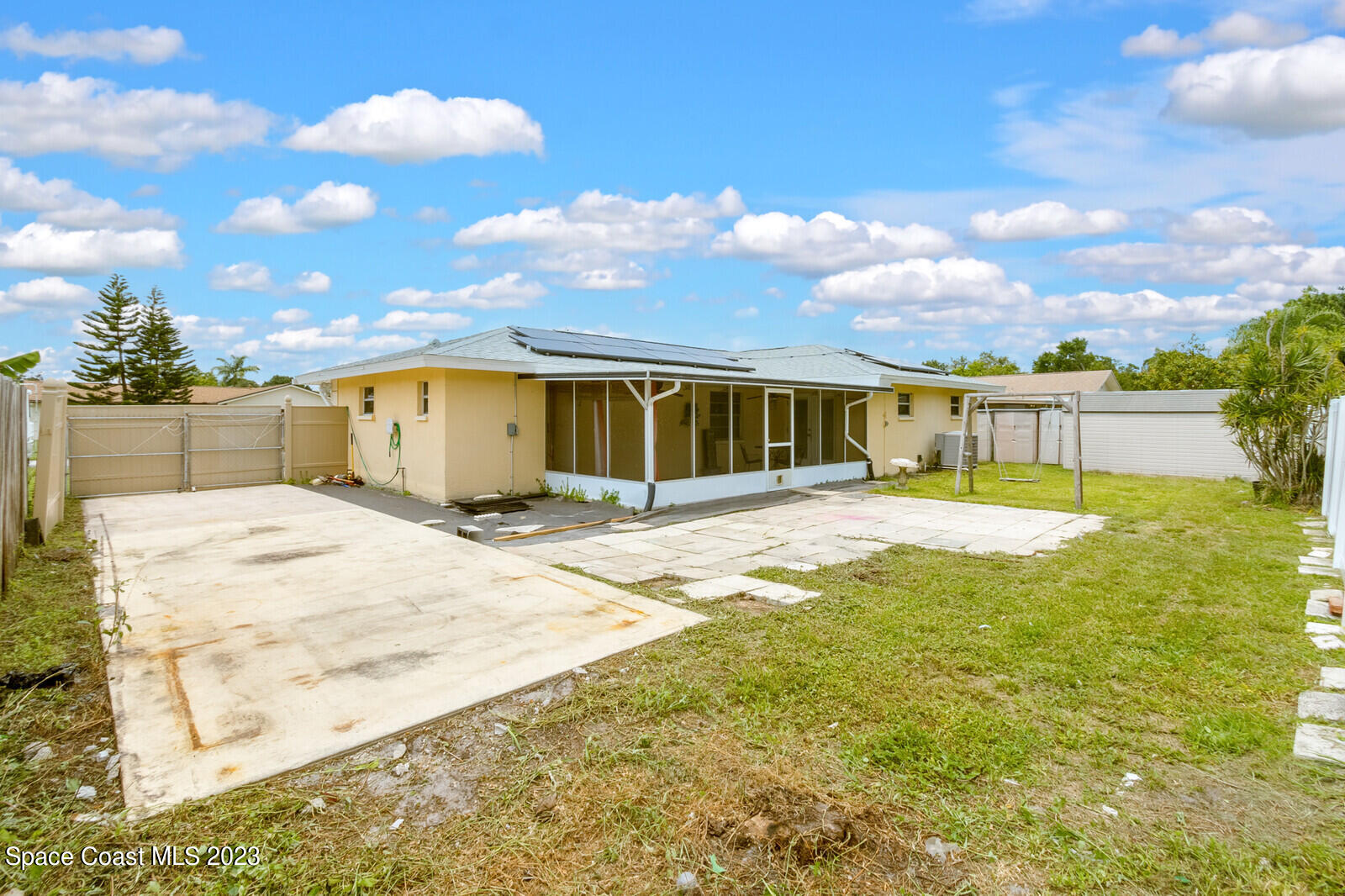 2567 Wright Avenue Melbourne, FL 32935 - Photo 36 of 36 a swimming pool with lawn chairs