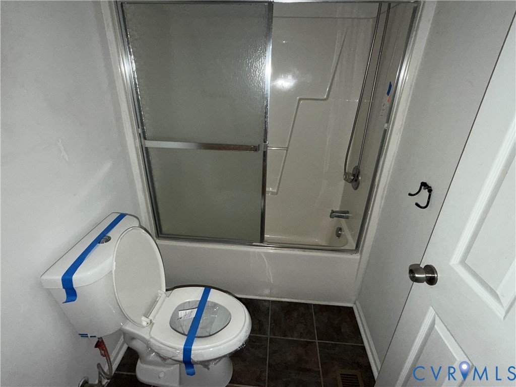 117 Pleasant Spring Avenue Waverly, VA 23890 - Photo 7 of 12 a bathroom with a sink and a mirror