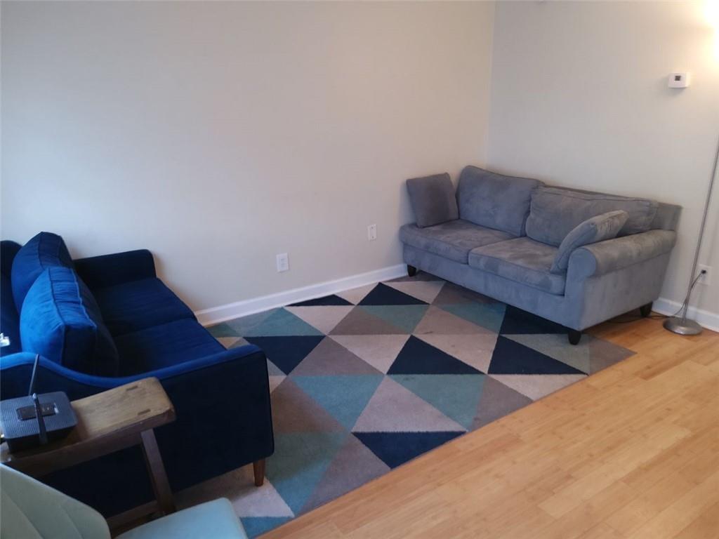 405 Fairburn Road Southwest, Unit 21 Atlanta, GA 30331 - Photo 2 of 16 a living room with furniture and a rug