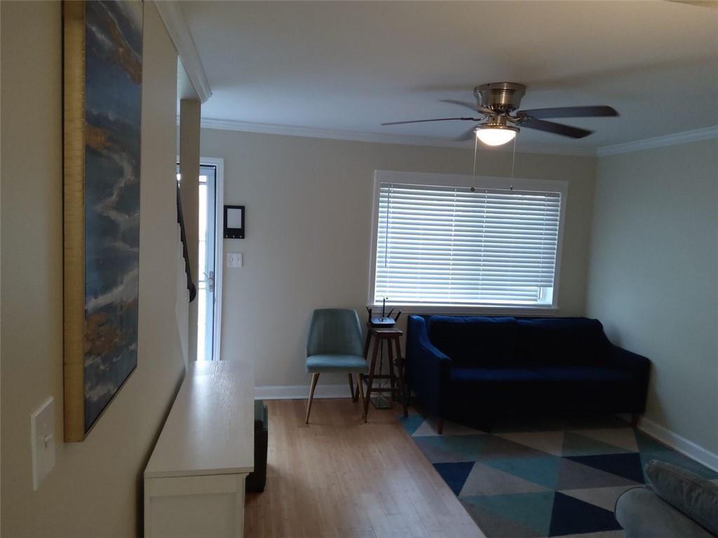405 Fairburn Road Southwest, Unit 21 Atlanta, GA 30331 - Photo 3 of 16 a living room with furniture and a window