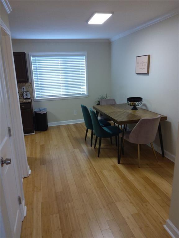 405 Fairburn Road Southwest, Unit 21 Atlanta, GA 30331 - Photo 4 of 16 a dining room with furniture and window