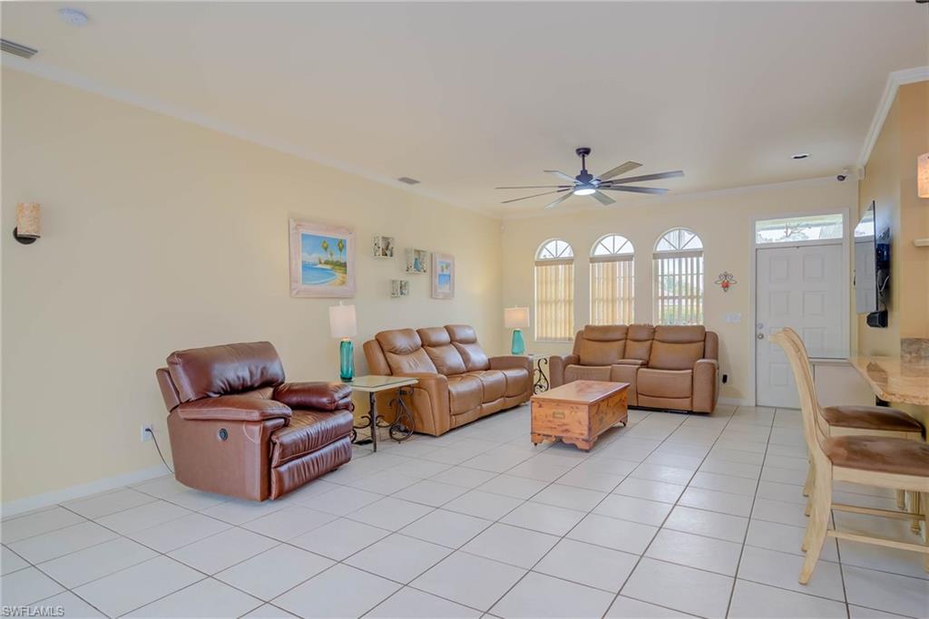 18370 Tulip Road Fort Myers, FL 33967 - Photo 6 of 30 a living room with furniture and a chandelier
