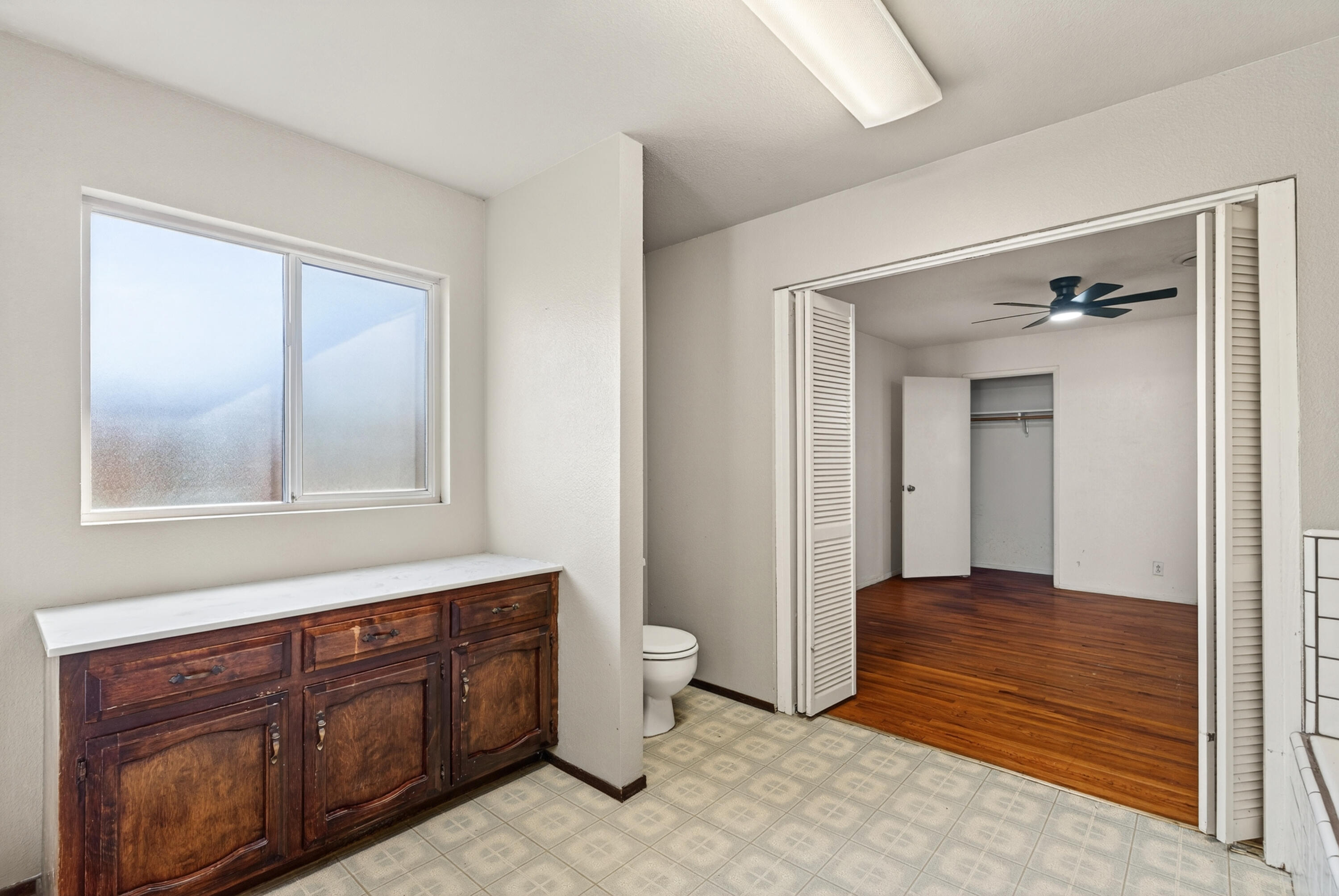 2068 Solar Way Redding, CA 96002 - Photo 19 of 36 a bathroom with a granite countertop sink toilet and mirror