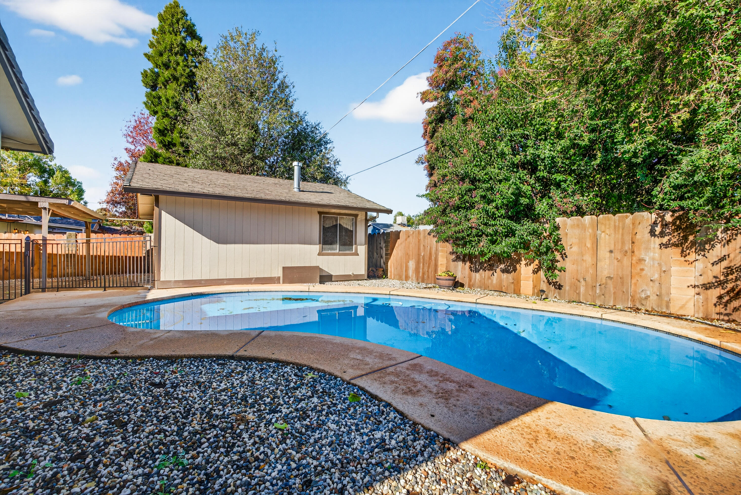 2068 Solar Way Redding, CA 96002 - Photo 34 of 36 a view of a house with pool and sitting area