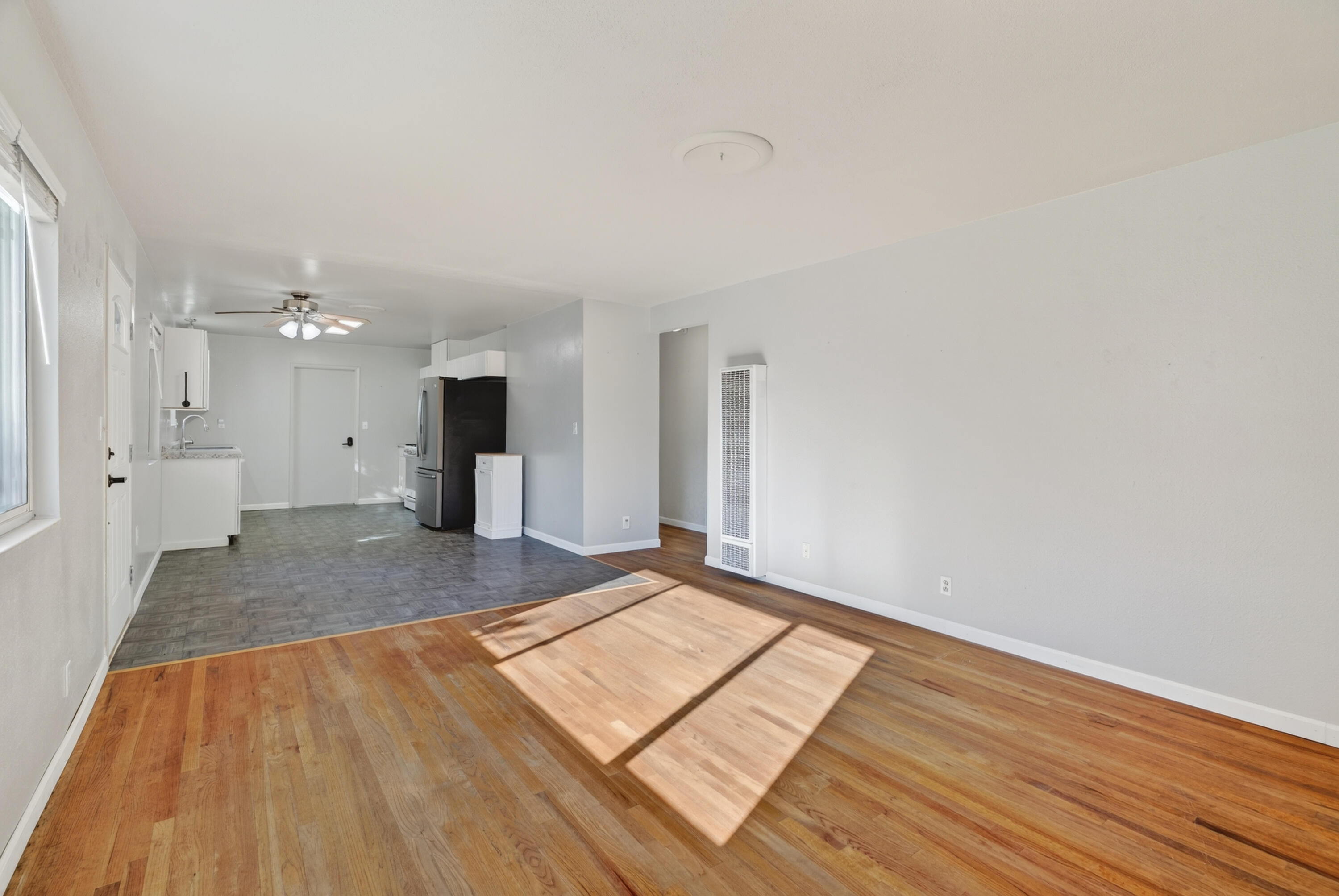 2068 Solar Way Redding, CA 96002 - Photo 8 of 36 a view of a big room with wooden floor and windows